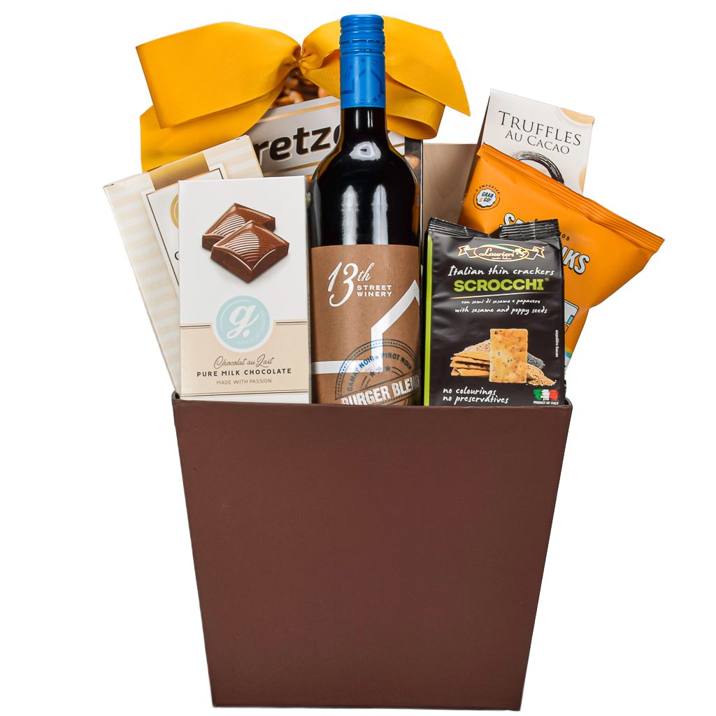 Classic Canadain Red With With Pretzels, Truffles, Milk Chocolate nd Shortbread Cookies In A Brown Gift Basket