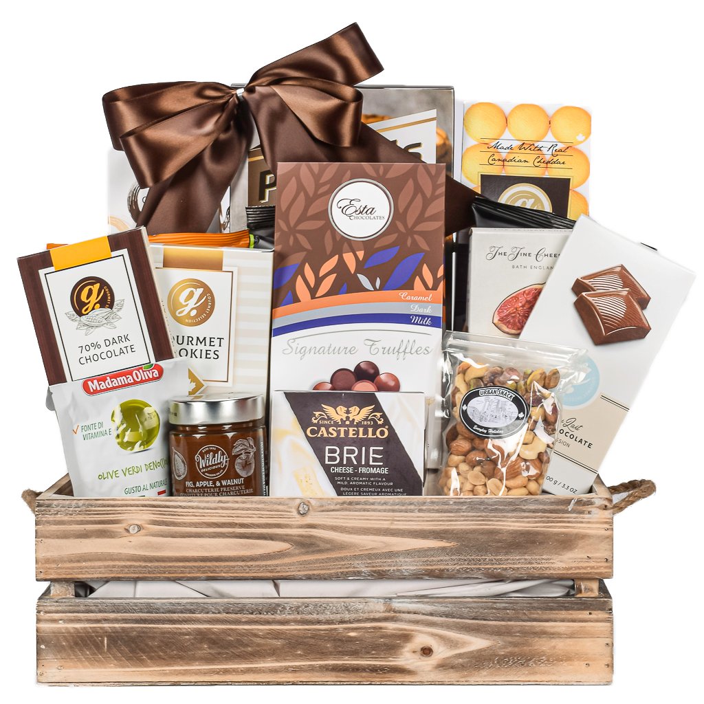 Gourmet gift basket with chocolate, cheese, and other snacks in a wooden crate.