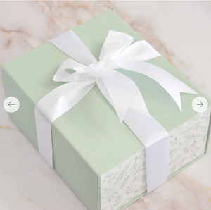 Gift Box Tied With A White Ribbon
