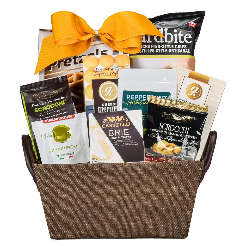 Brown Fabric Gift Basket With Chips, Pretzels, Cheese, Olives, Tea, Cookies, And Chips With A Gold Bow