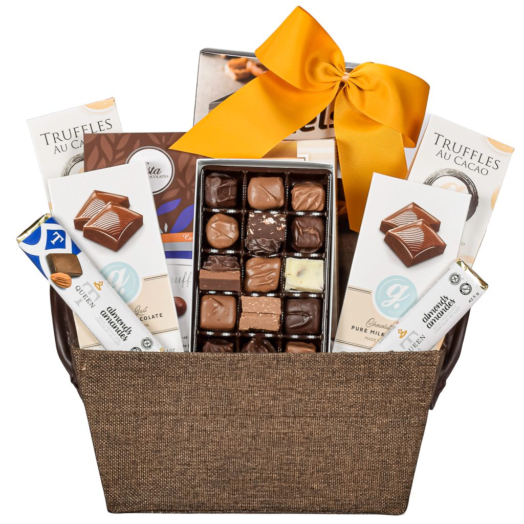 Chocolate gift basket with a variety of truffles, chocolates, cookies, and pretzels with a gold bow