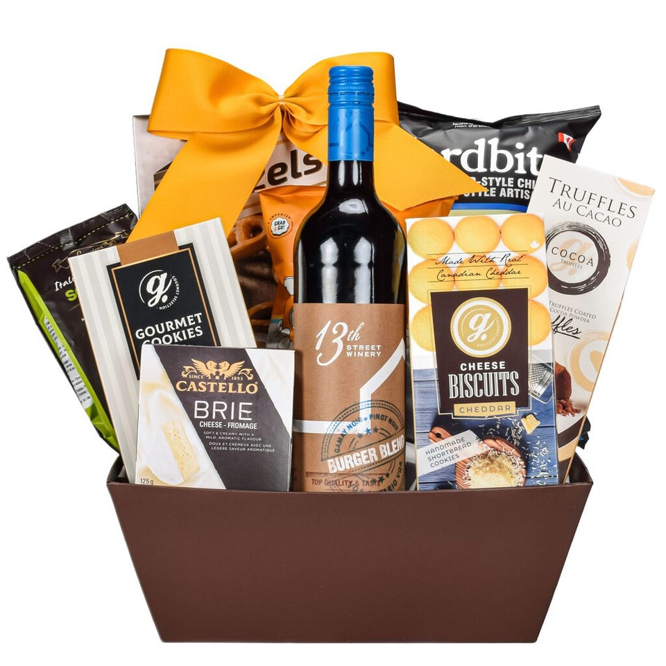 Brown Rectangular Gift Basket With Canadian Wine, Chips, Pretzels, Crackers, Cookies, Truffles, And Popcorn With Gold Bow