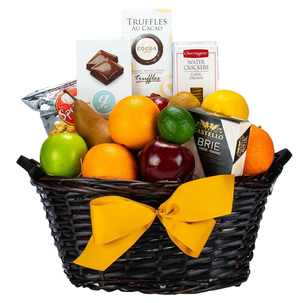 Brown Wicker Gift Basket With Oranges, Grapfruits, Kiwis, Red Apples, Greeen Apples And Some Sweet And Savoury Treats