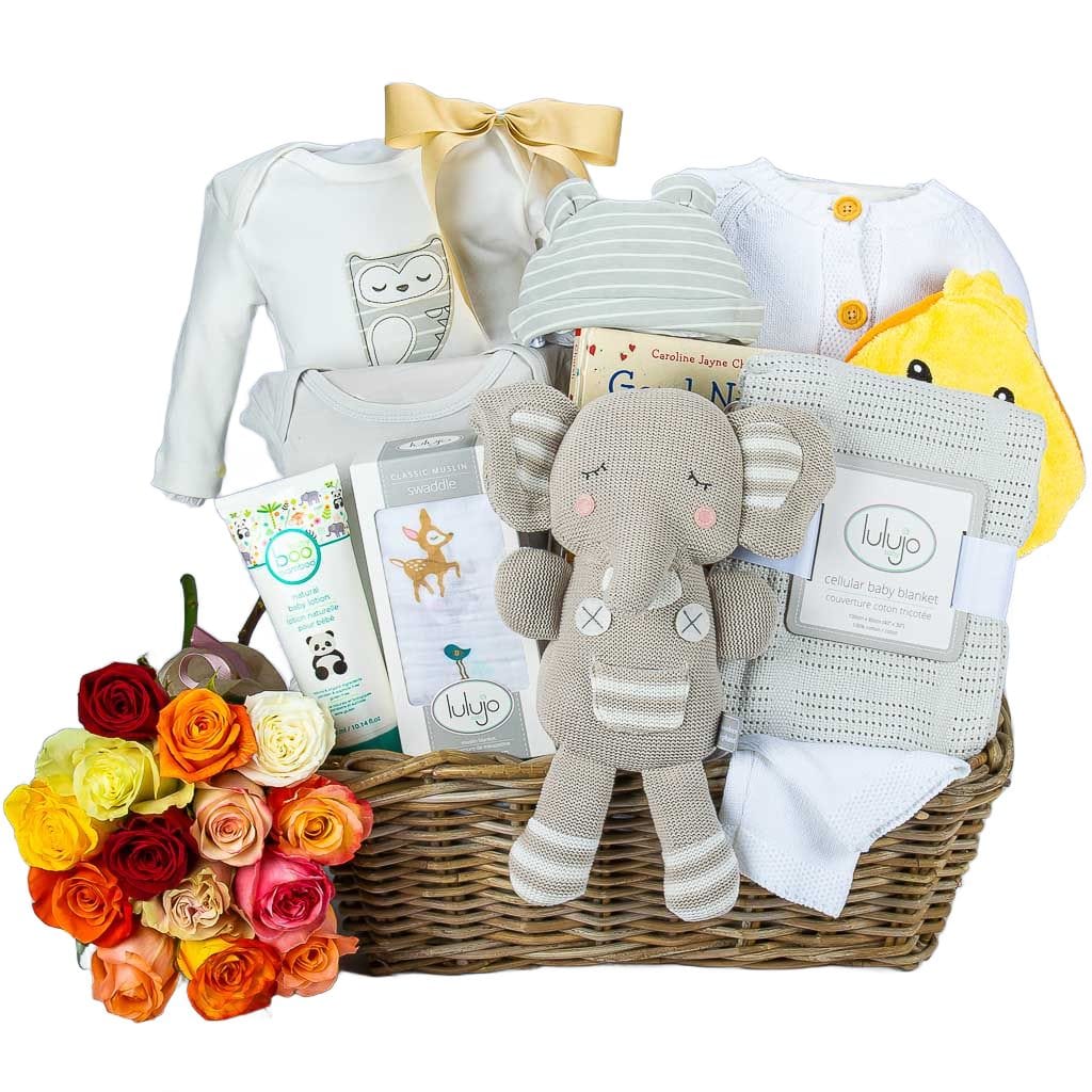 Neutral Baby Basket With Organic Clothes And Roses