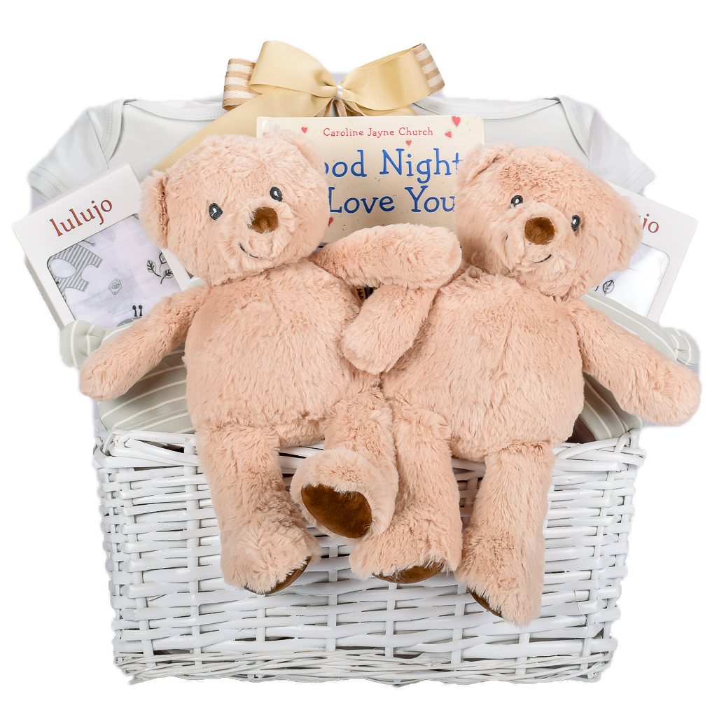 White Wicker Basket With Neutral Teddy, Baby Book, Muslin Blankets, And Organic Hat 