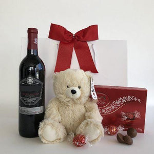 Wine, plush bear and chocolates gift