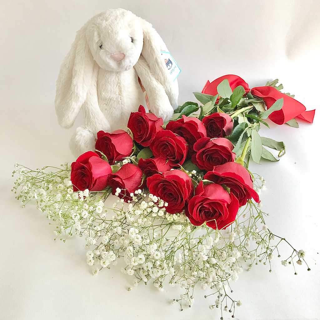 Plush bunny and red roses